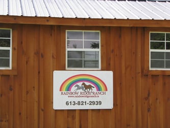 Rainbow Ridge Ranch sign on storage shed